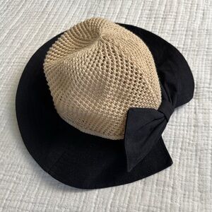 adorable straw hat with black bow detail